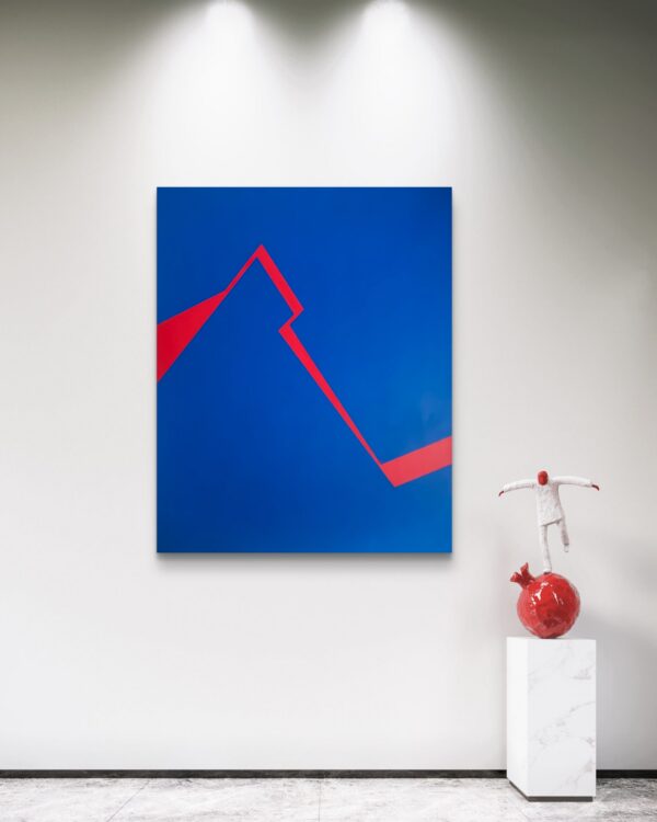 Minimalist abstract art in blue and red by Veronika Obushikhina displayed in a modern gallery with a contemporary sculpture