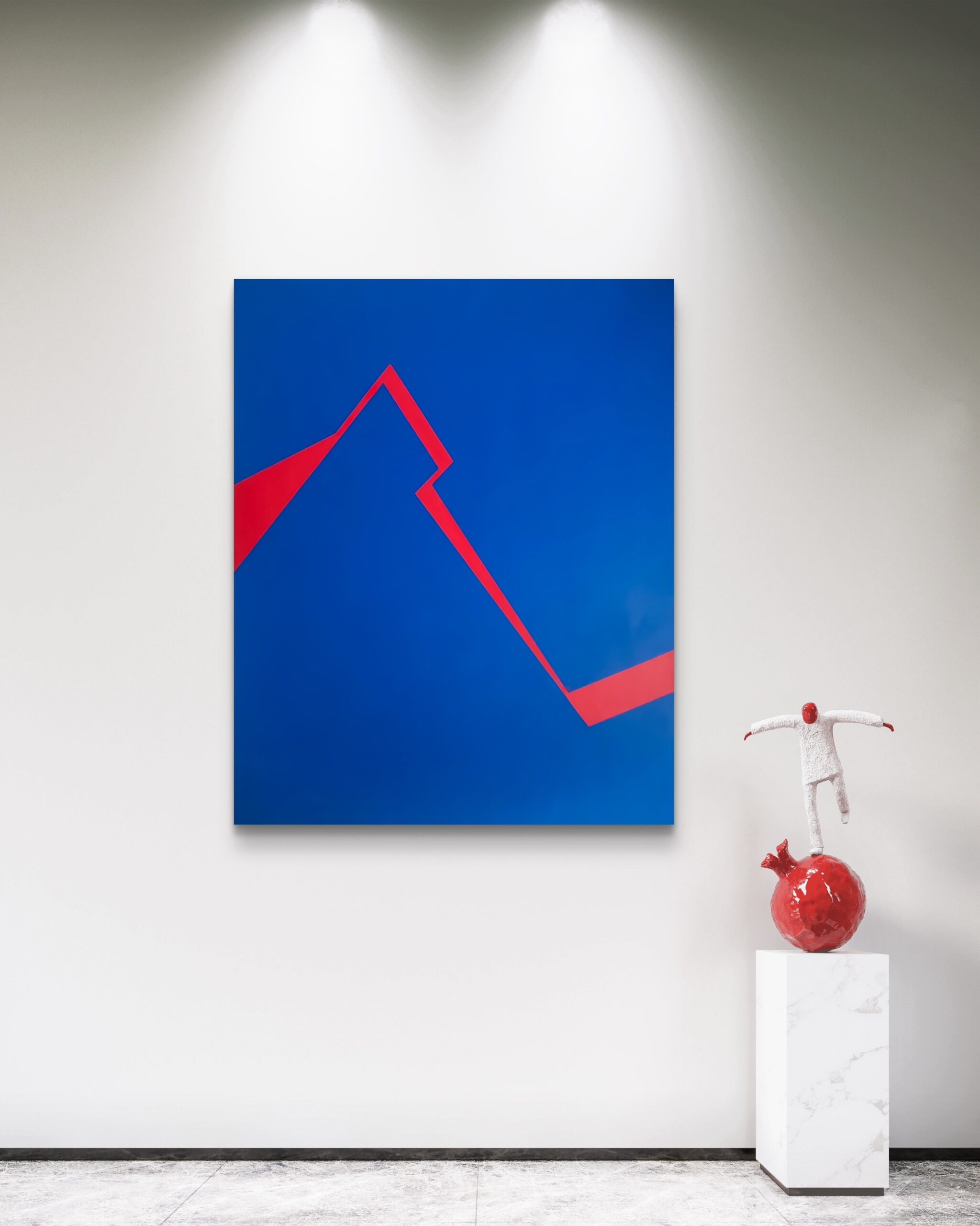 Minimalist abstract art in blue and red by Veronika Obushikhina displayed in a modern gallery with a contemporary sculpture