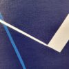 Minimalist abstract painting part with a sharp white fractured line on blue background by Veronika Obushikhina