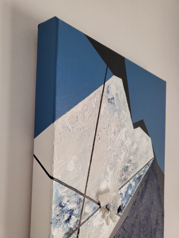 Rift 2 by Veronika Obushikhina, abstract geometric painting side with raw quartz crystals, rough white and navy textures, and sharp black lines on a blue background