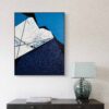 Rift 2 by Veronika Obushikhina, abstract geometric painting in interior with raw quartz crystals, rough white and navy textures, and sharp black lines on a blue background
