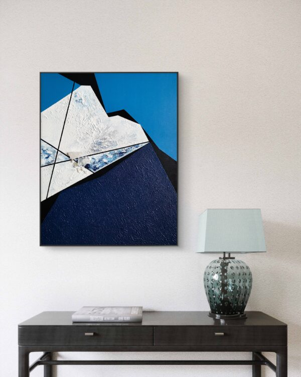 Rift 2 by Veronika Obushikhina, abstract geometric painting in interior with raw quartz crystals, rough white and navy textures, and sharp black lines on a blue background