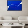 Minimalist abstract painting in a gallery by Veronika Obushikhina with bold blue shapes, white negative space, and a sharp red fractured line. Contemporary geometric composition expressing dynamic tension and clarity.