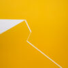 Minimalist abstract painting with a sharp white fractured line on yellow background by Veronika Obushikhina