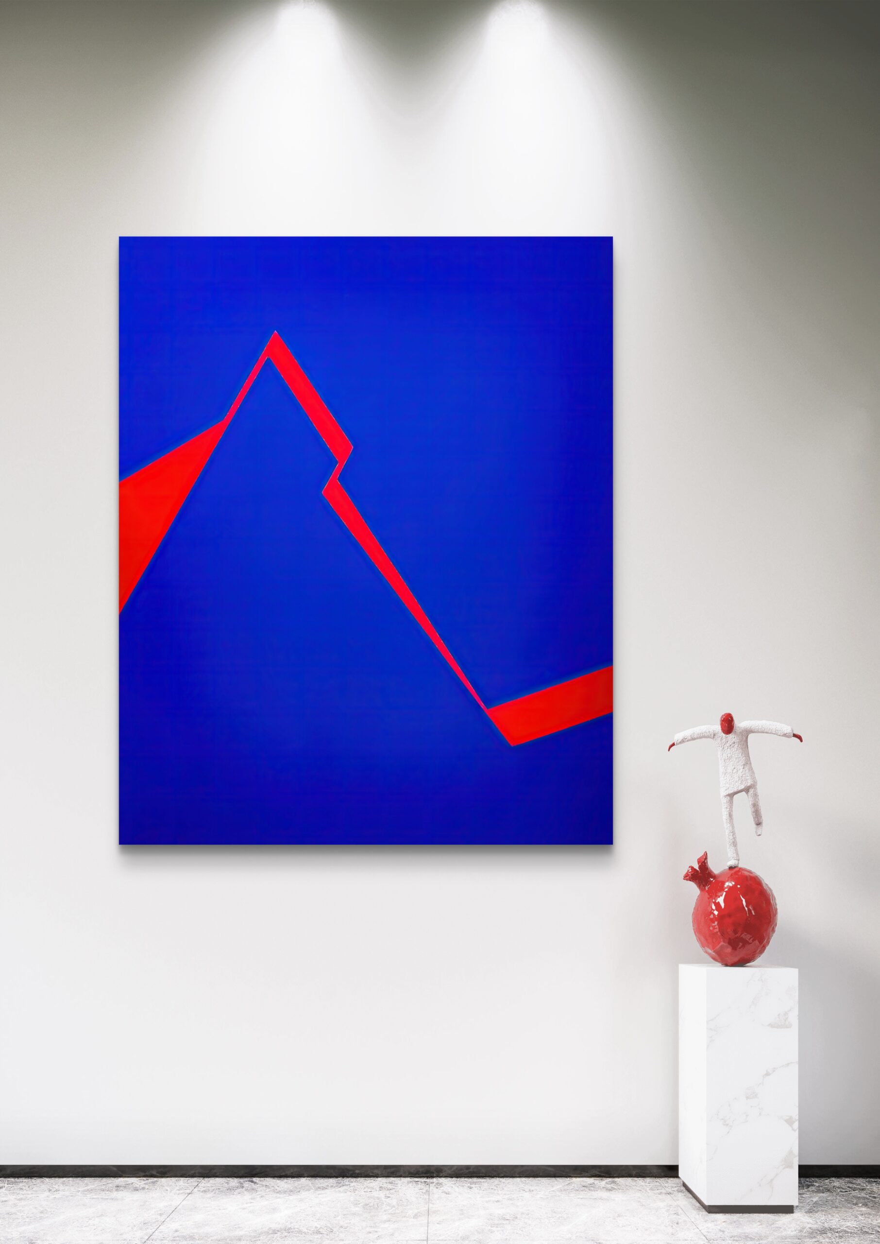 Minimalist abstract art in blue and red by Veronika Obushikhina displayed in a modern gallery with a contemporary sculpture
